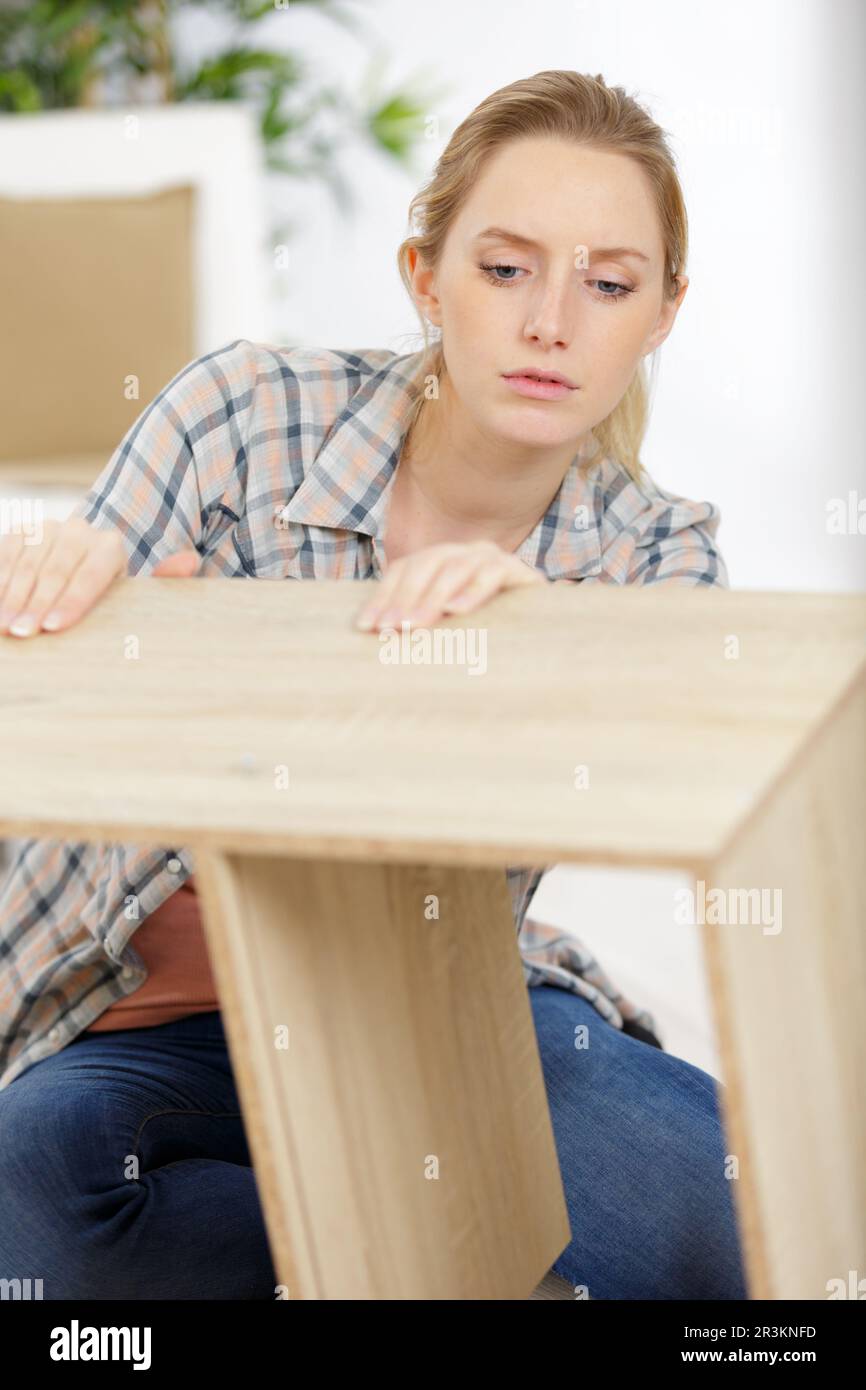 woman checking the new furniture Stock Photo Alamy