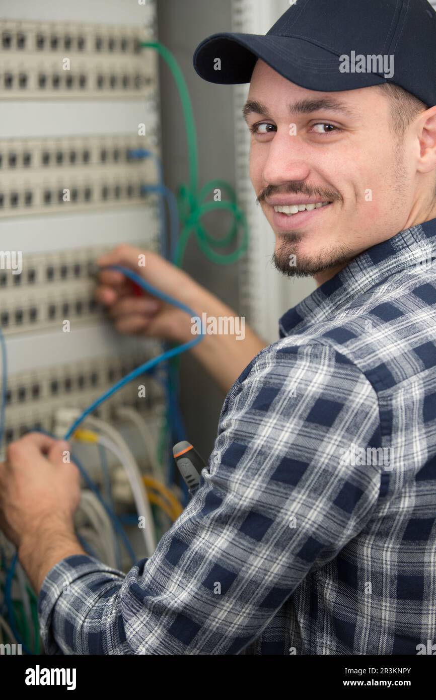 electrician technician works with cable of a residential electrical