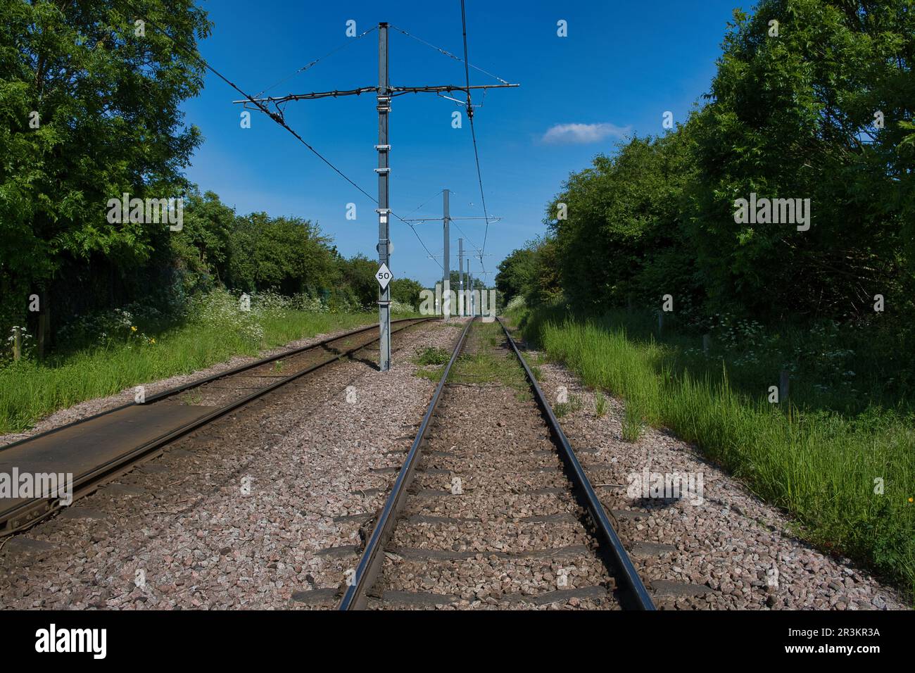 tram line running through South Norwood Park in Croydon, South London Stock Photo