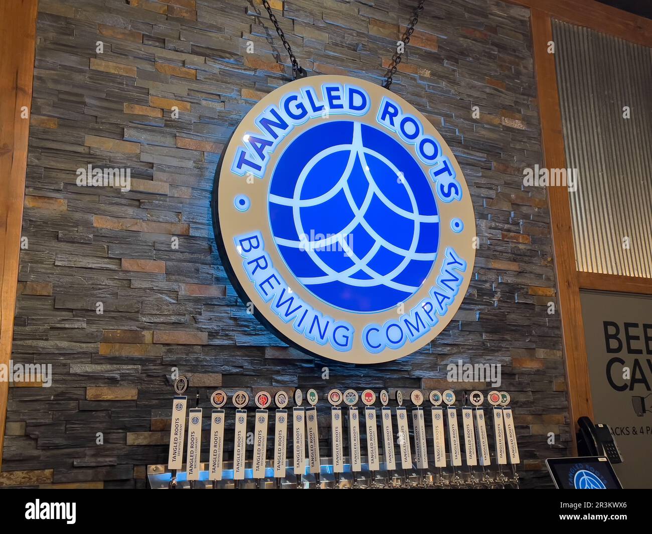 Tangled Roots is a craft beer brewing company that creates fresh products from their local farm. Stock Photo