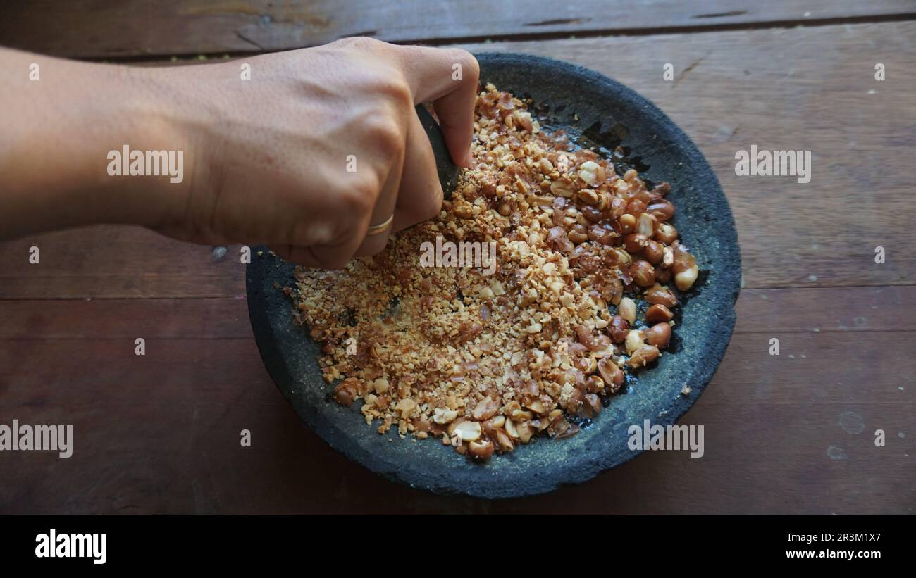 High angle view of a peanut grinder by hand. Stock Photo