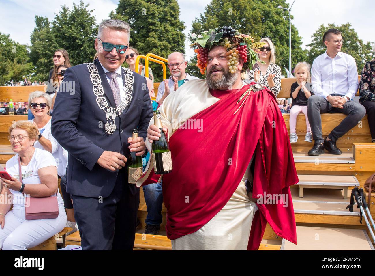Mayor of Zielona Gora; Janusz Kubicki and a man in a Bacchus costume seen during the traditional Winobranie Wine Festival Parade. The local winemakers and artists, schools, as well as the residents of Zielona Gora take part in it, strolling down the main streets of the city in colourful disguises. Zielona Gora Wine Fest is a wine festival held in the Polish town of Zielona Gora. Winobranie is the biggest wine festival in Poland. The first festival took place in October 1852.During the Winobranie Wine Festival week, Bacchus, the god of wine and a symbol of Zielona Gora, gets the keys to the cit Stock Photo