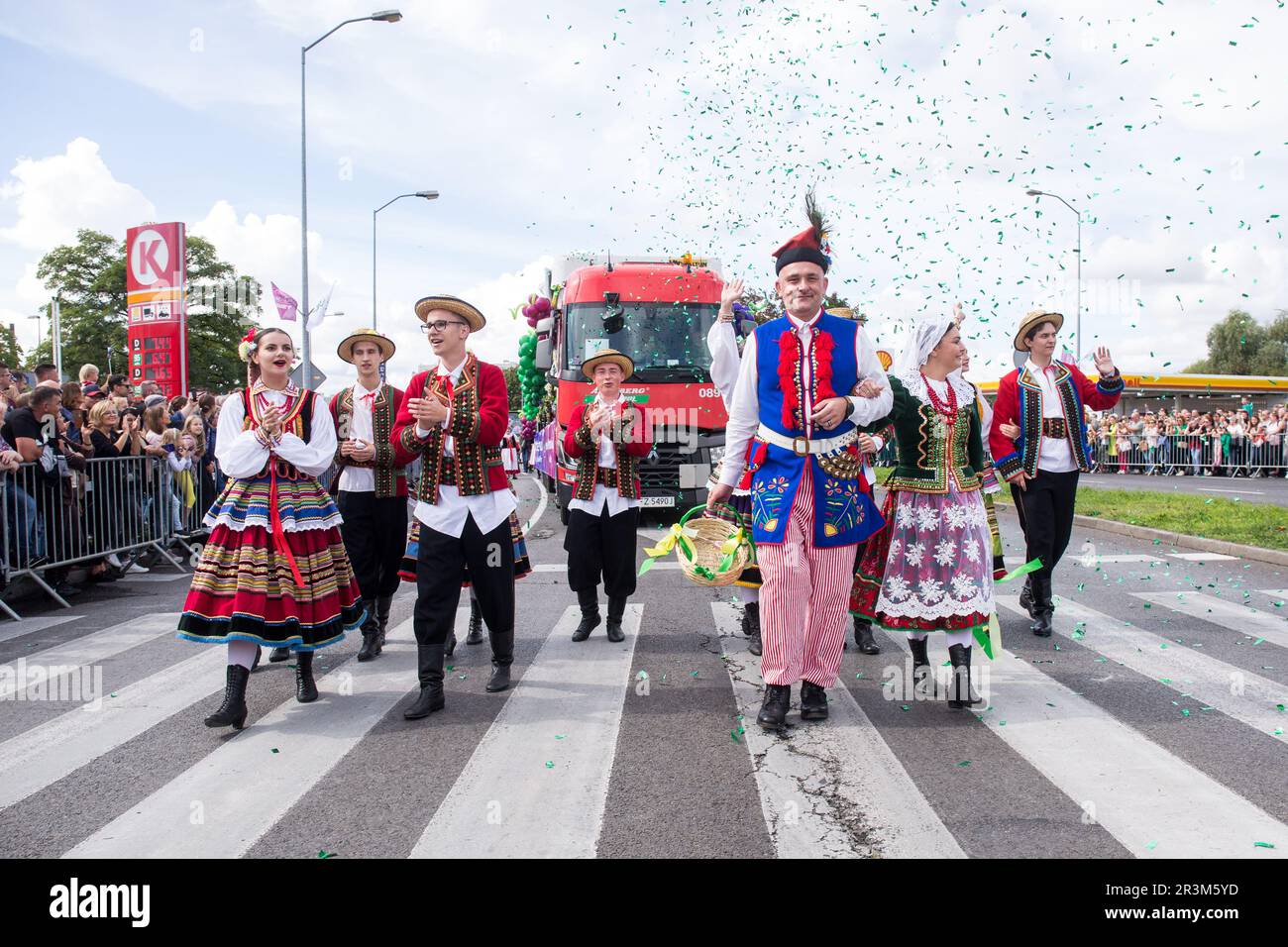 People in colorful folk costumes seen during the traditional Winobranie Wine Festival Parade. The local winemakers and artists, schools, as well as the residents of Zielona Gora take part in it, strolling down the main streets of the city in colourful disguises. Zielona Gora Wine Fest is a wine festival held in the Polish town of Zielona Gora. Winobranie is the biggest wine festival in Poland. The first festival took place in October 1852.During the Winobranie Wine Festival week, Bacchus, the god of wine and a symbol of Zielona Gora, gets the keys to the city and thus takes a power over it. Un Stock Photo