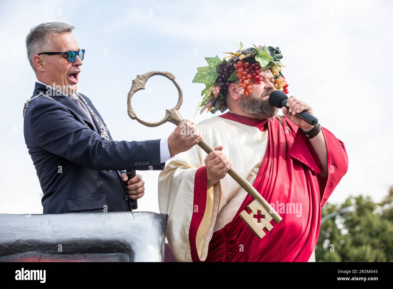 Mayor of Zielona Gora; Janusz Kubicki and a man in a Bacchus costume seen during the traditional Winobranie Wine Festival Parade. The local winemakers and artists, schools, as well as the residents of Zielona Gora take part in it, strolling down the main streets of the city in colourful disguises. Zielona Gora Wine Fest is a wine festival held in the Polish town of Zielona Gora. Winobranie is the biggest wine festival in Poland. The first festival took place in October 1852.During the Winobranie Wine Festival week, Bacchus, the god of wine and a symbol of Zielona Gora, gets the keys to the cit Stock Photo