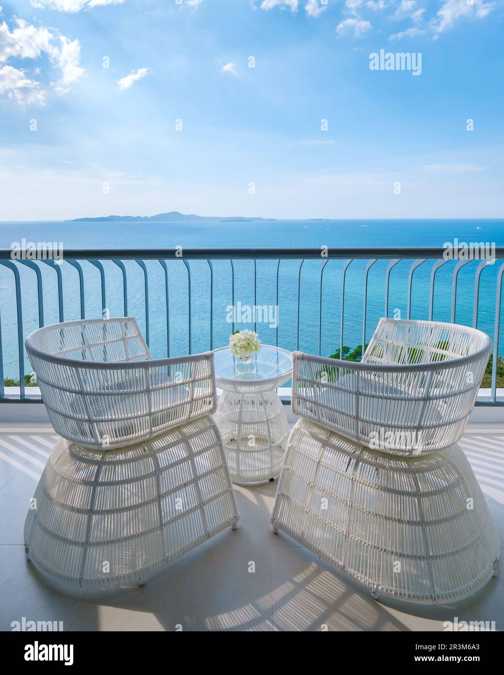 Chairs on the balcony with a view at the blue ocean Stock Photo - Alamy