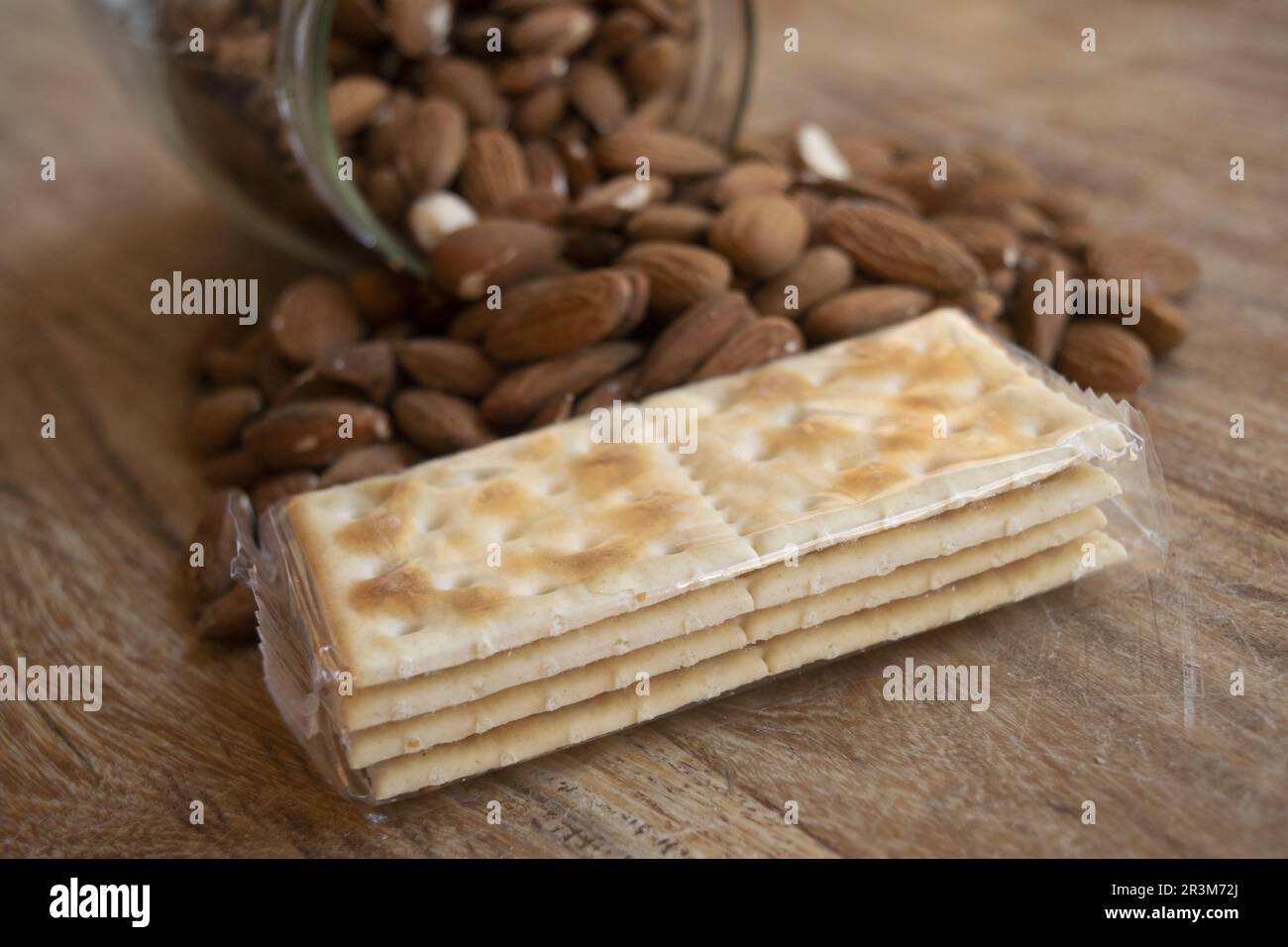 crackers and almonds for a diet of healthy carbohydrates and fats Stock Photo