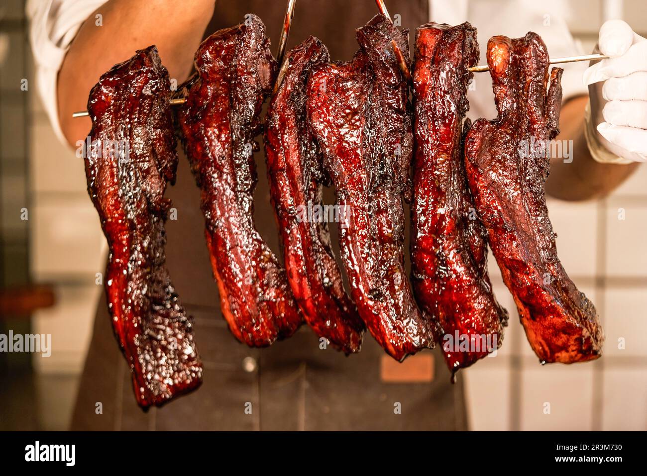 Char Siu - Honey barbecue roast pork on wood tray of wood table - Chinese style grilled pork at close up view,chinese siu mei Stock Photo