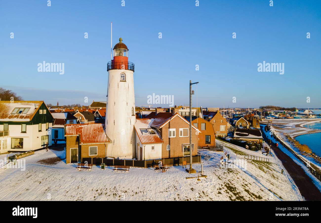 Urk lighthouse during winter with snow in the Netherlands Stock Photo