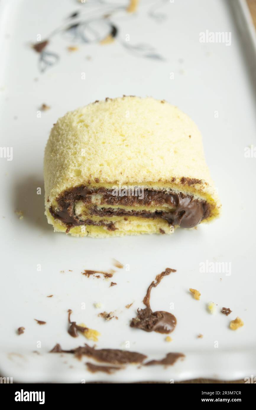 vanilla roll filled with melted chocolate Stock Photo Alamy