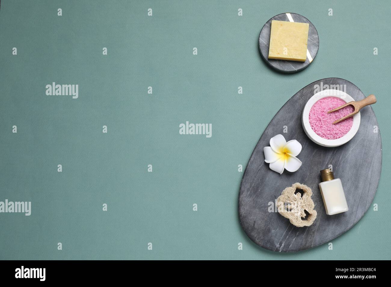 Flat lay composition with spa items on pale green background, space for text Stock Photo
