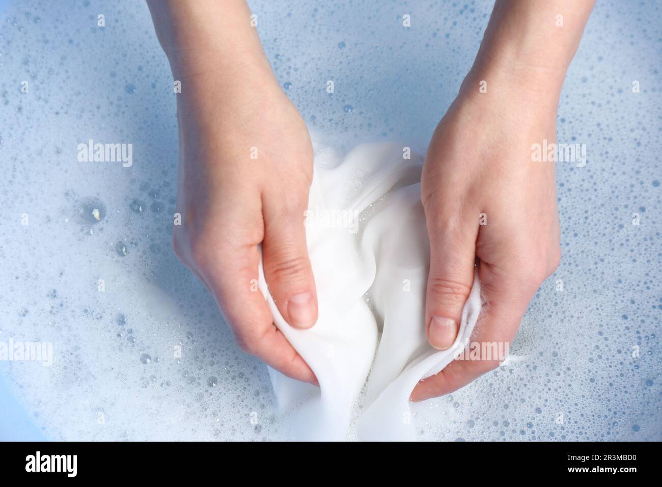Woman hand washing white clothing suds hi-res stock photography and ...