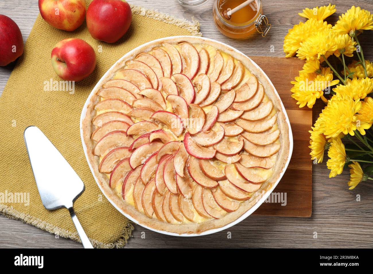 Flat lay composition with tasty apple pie on wooden table Stock Photo