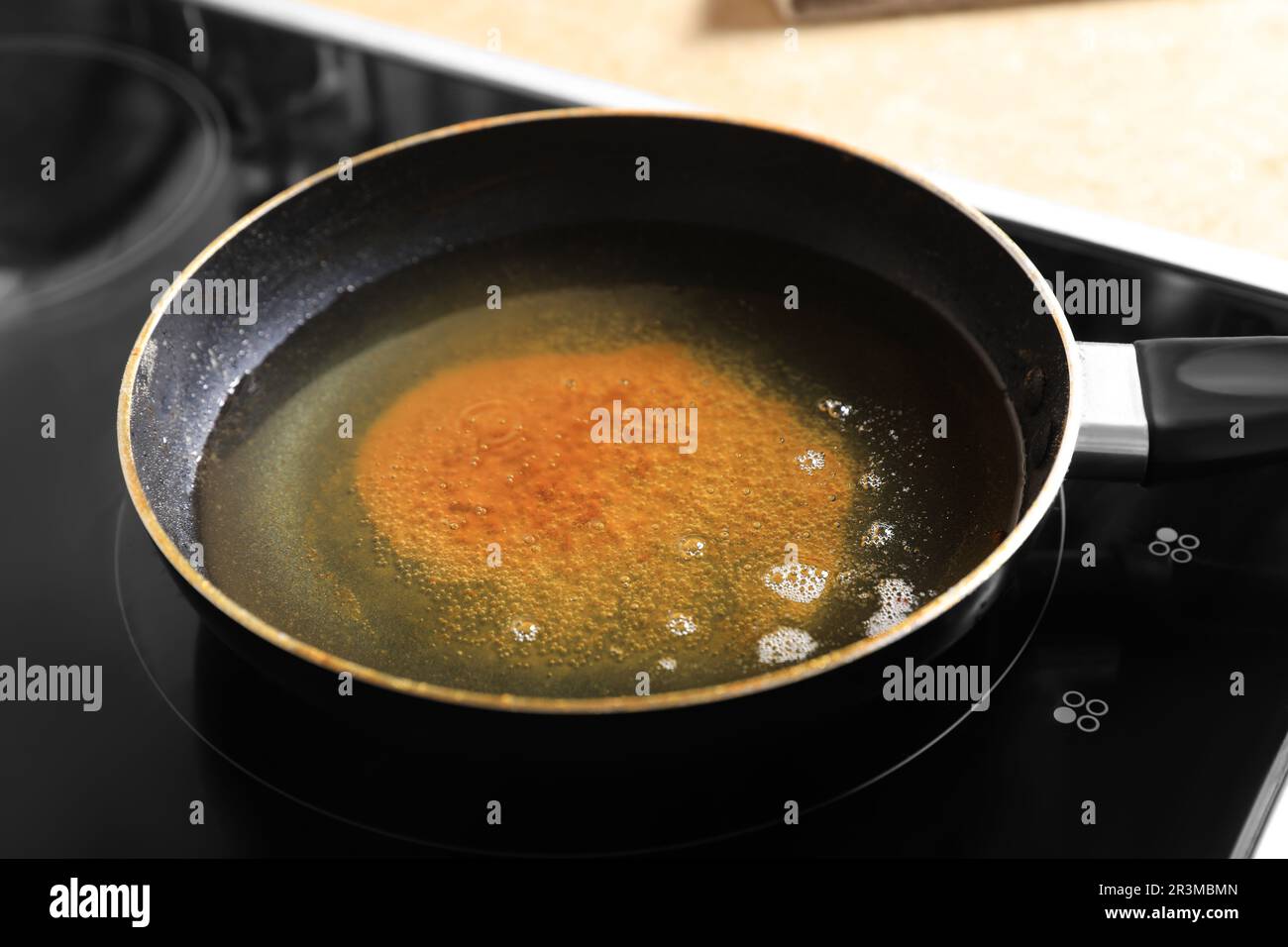 Frying pan with used cooking oil on stove, closeup Stock Photo Alamy