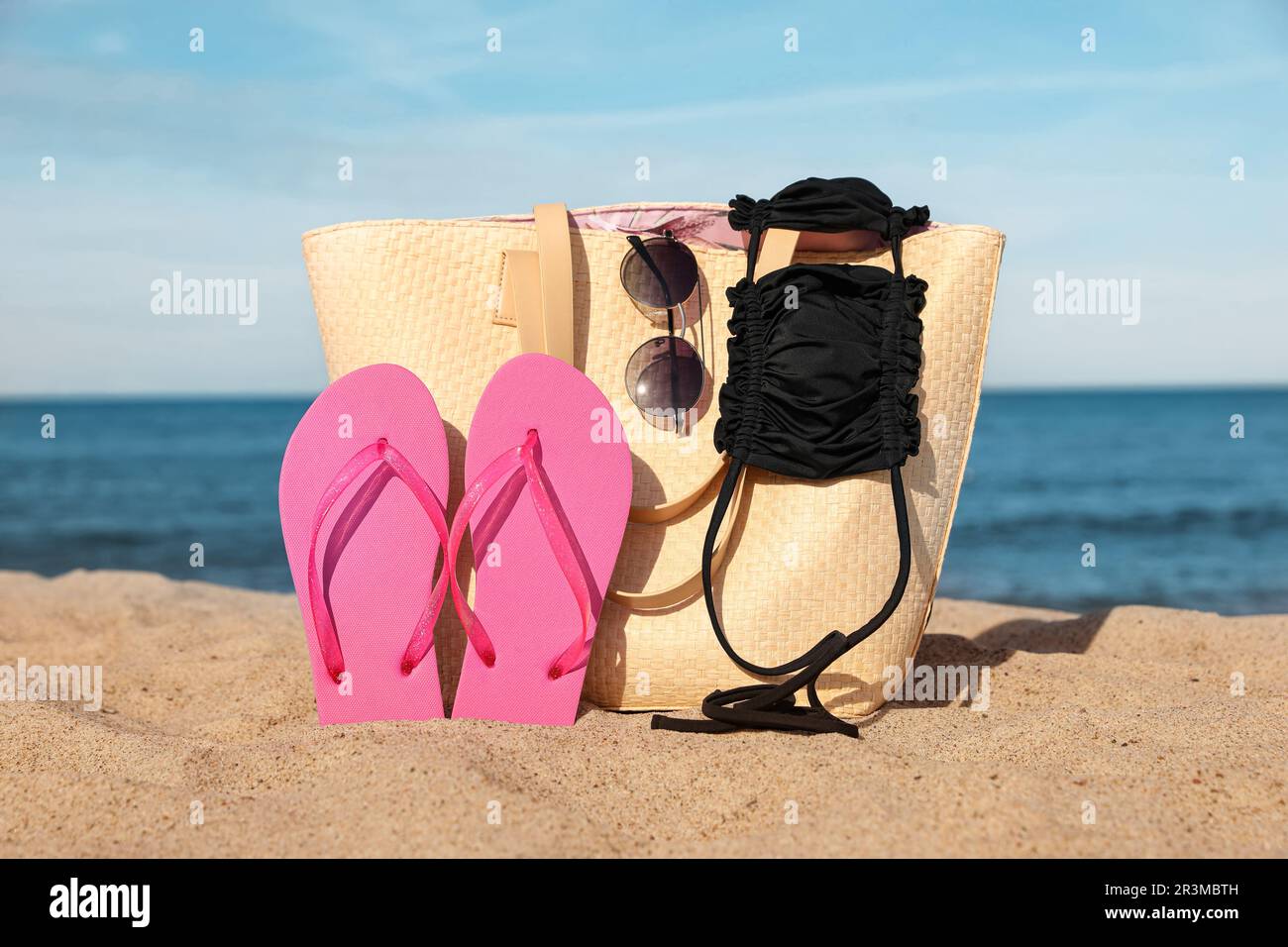 Stylish Striped Bag Slippers Seashell Sandy Beach Sea Stock Photo by  ©NewAfrica 616479018