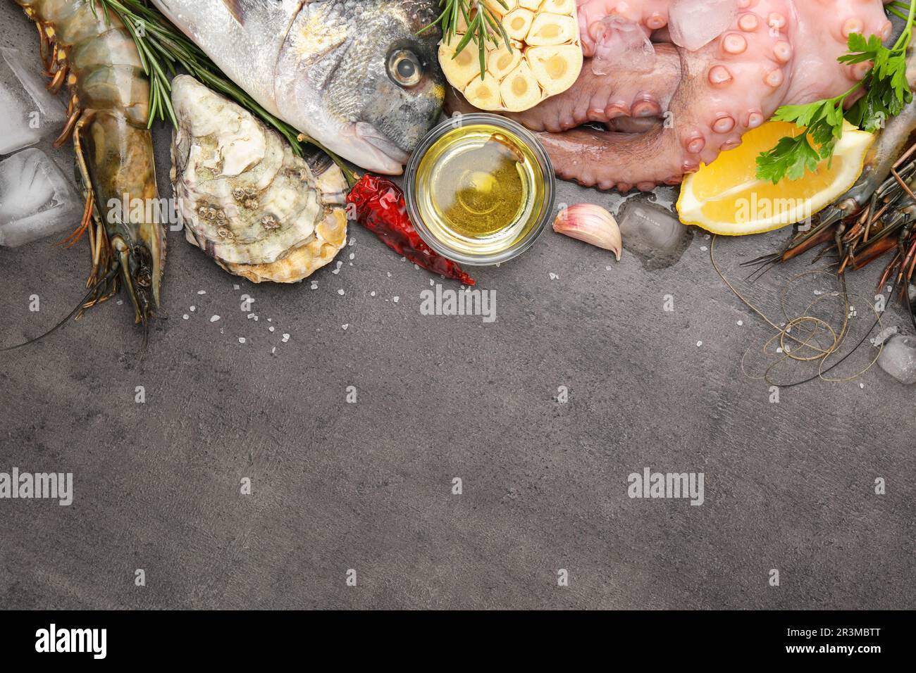 Flat lay composition with fresh raw dorado fish and different seafood ...