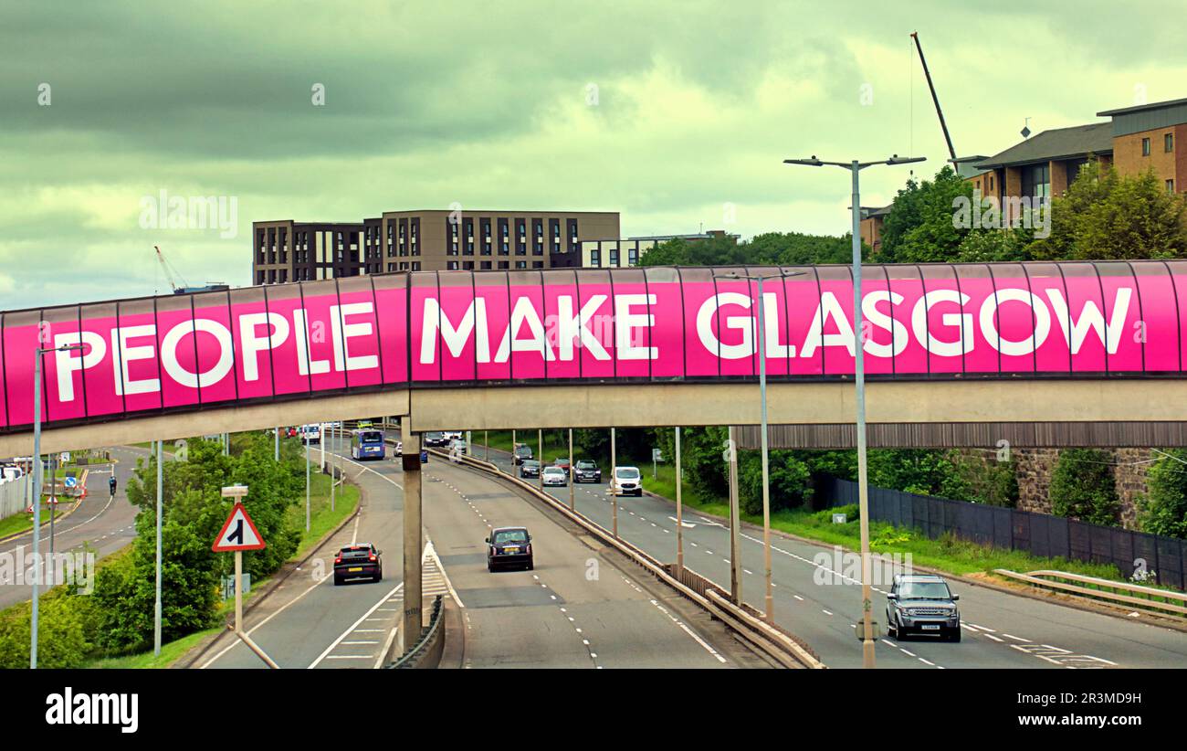 Glasgow, Scotland, UK 24th  May, 2023. UK Weather: Warm in the city centre saw locals take to the streets to enjoy city life. Council propaganda over the clydeside expressway at the sec.  Credit Gerard Ferry/Alamy Live News Stock Photo