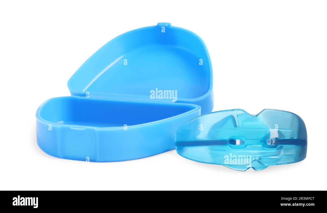 Transparent dental mouth guard and container on white background. Bite correction Stock Photo