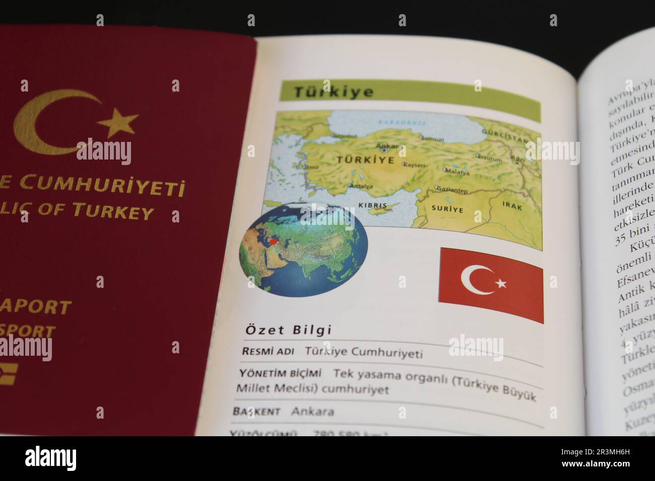 A book with a turkish passport and a turkey flag on it. Turkish map and ...