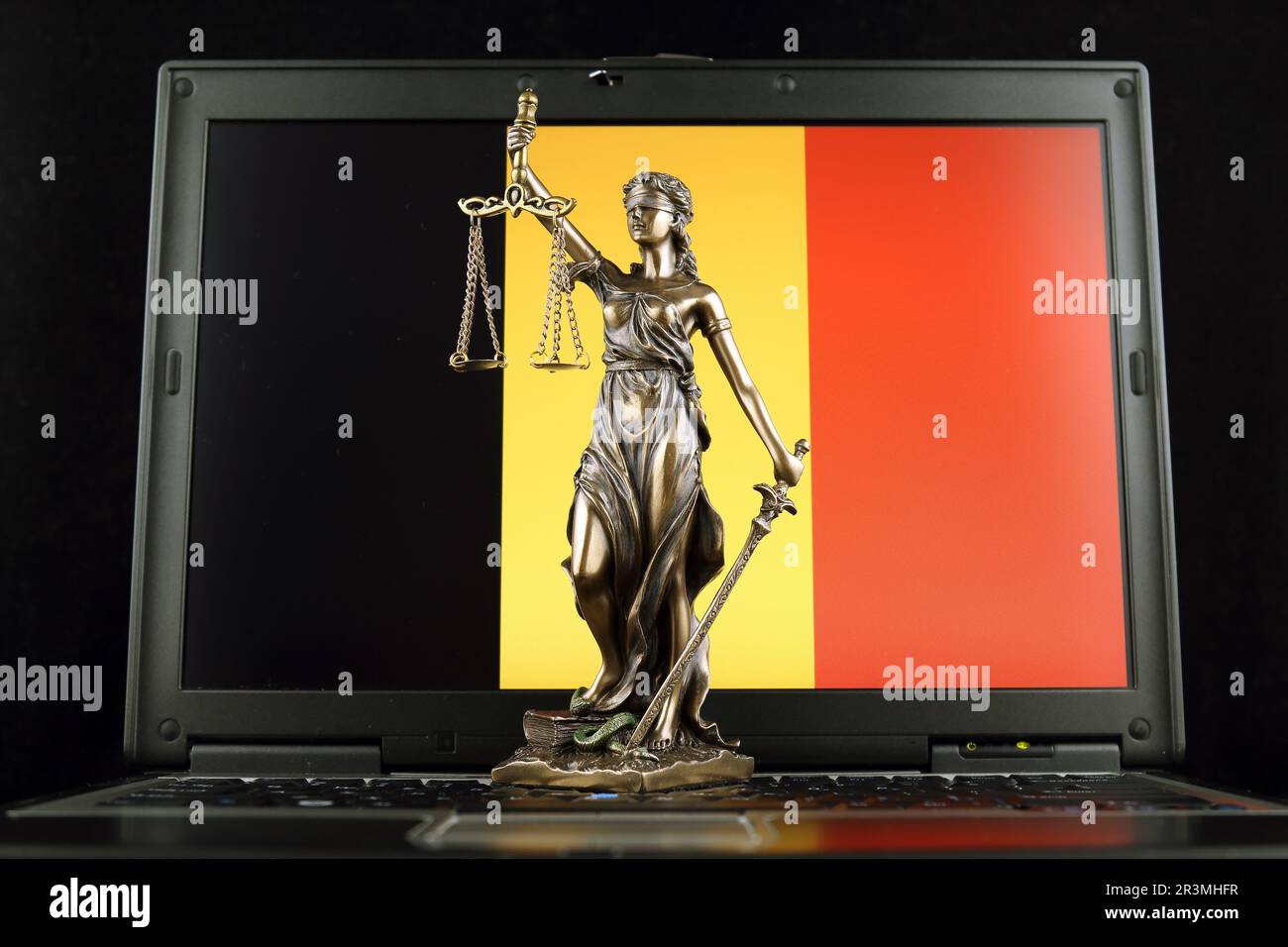 Symbol of law and justice with Belgium Flag on laptop. Studio shot. Stock Photo