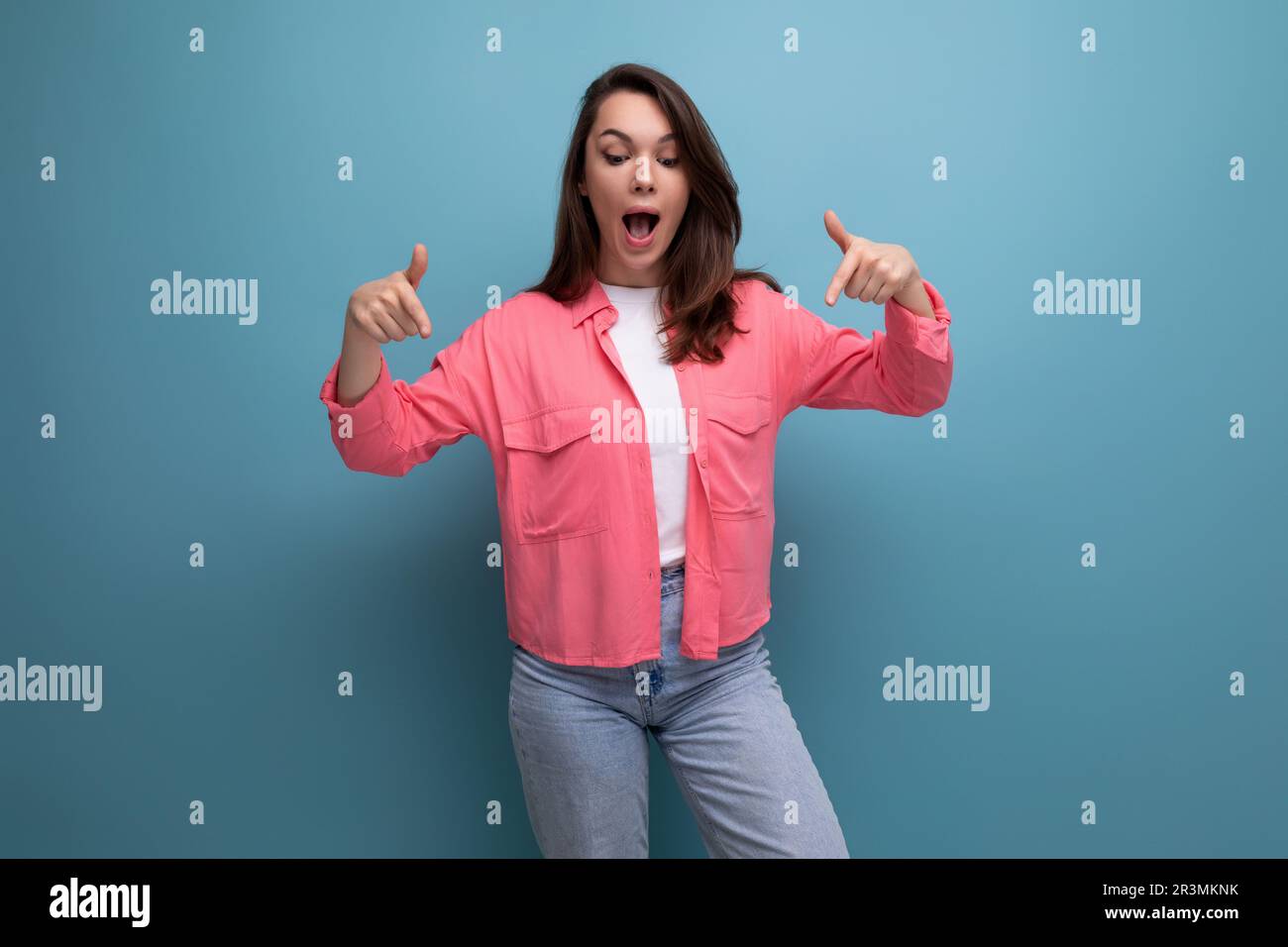 active emotional black-haired lady in casual style on studio background Stock Photo