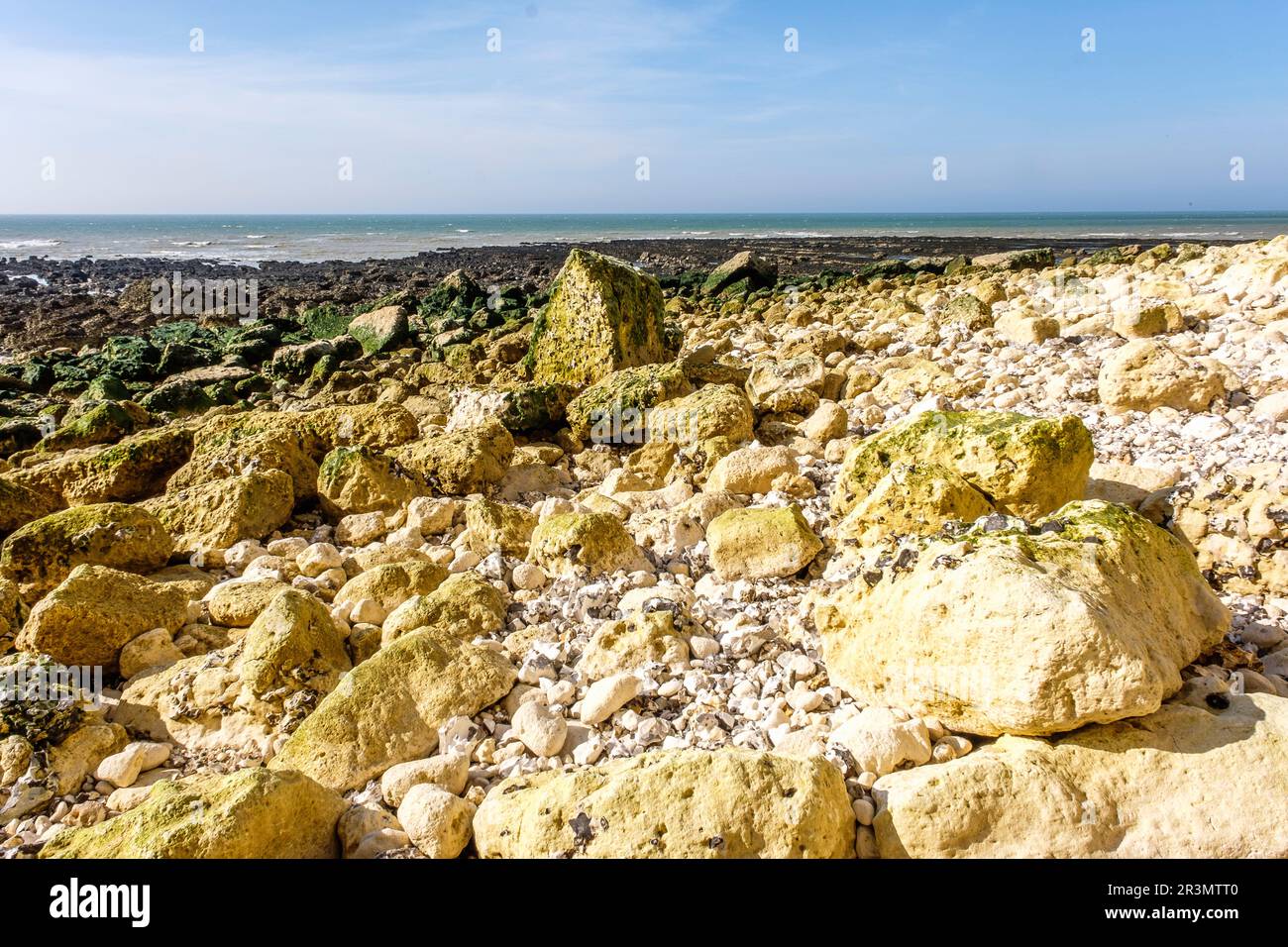 The pebble beach and the cliffs at Saint-Pierre-En-Port - Part of the ...