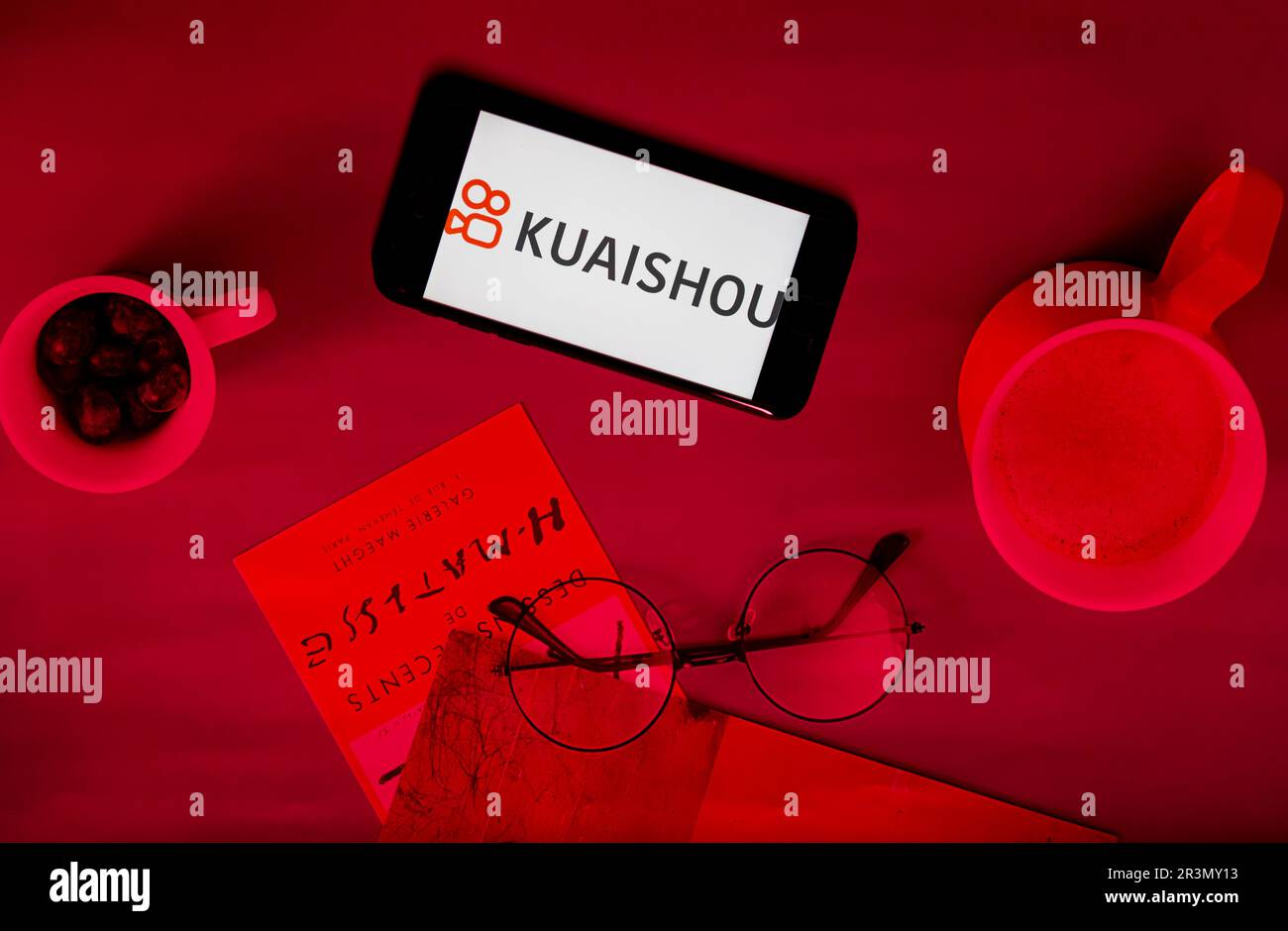 In this photo illustration a Kuaishou (Kwai) logo is seen on a smartphone  and a pc screen. (Photo by Pavlo Gonchar / SOPA Images/Sipa USA Stock Photo  - Alamy