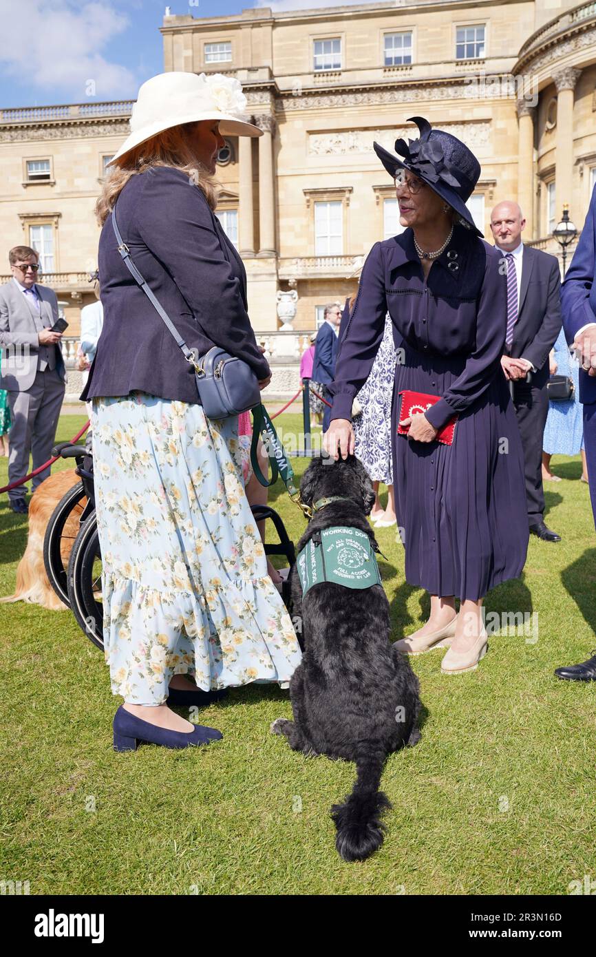 The Duchess of Gloucester speaks with a guest and their dog, during the Royal Kennel Club Garden Party at Buckingham Palace in London. Picture date: Wednesday May 24, 2023. Stock Photo