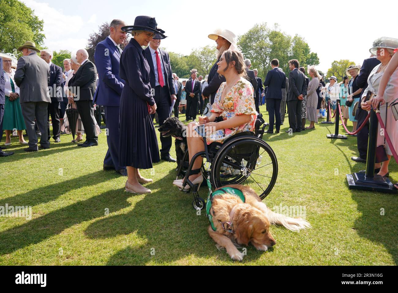 The Duchess of Gloucester speaks with Isabelle Atkins and Rumba, her mobility assistance dog, during the Royal Kennel Club Garden Party at Buckingham Palace in London. Picture date: Wednesday May 24, 2023. Stock Photo