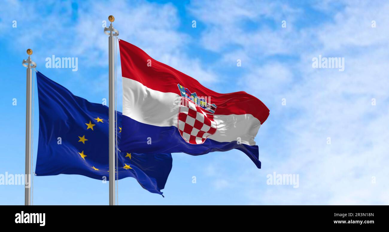 The flags of Croatia and the European Union flutter together on a clear day Stock Photo