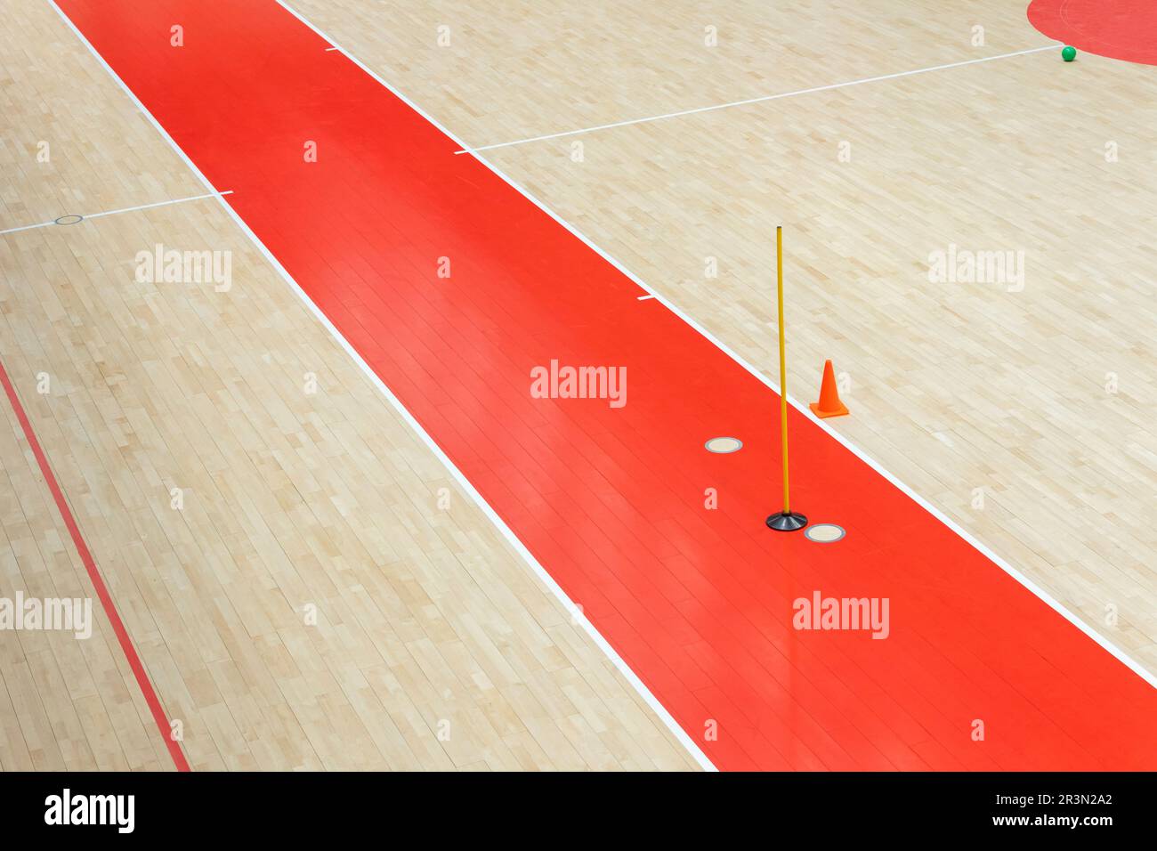 Training cones and ball on hardwood court floor. Basketball, futsal