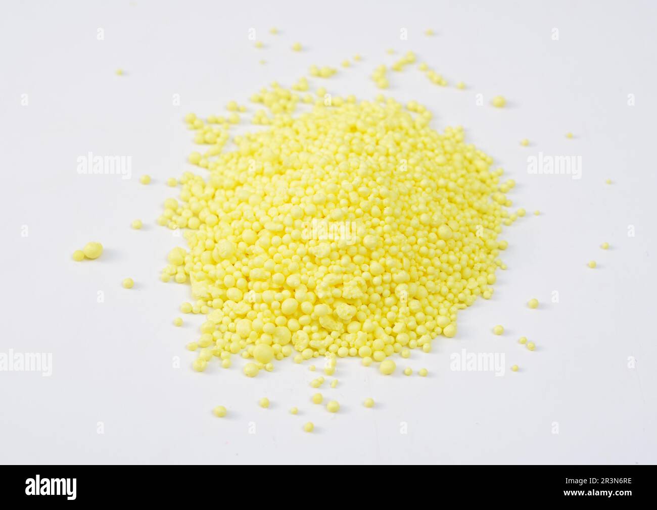Granulated Sulfur or sulphur on white background Stock Photo - Alamy