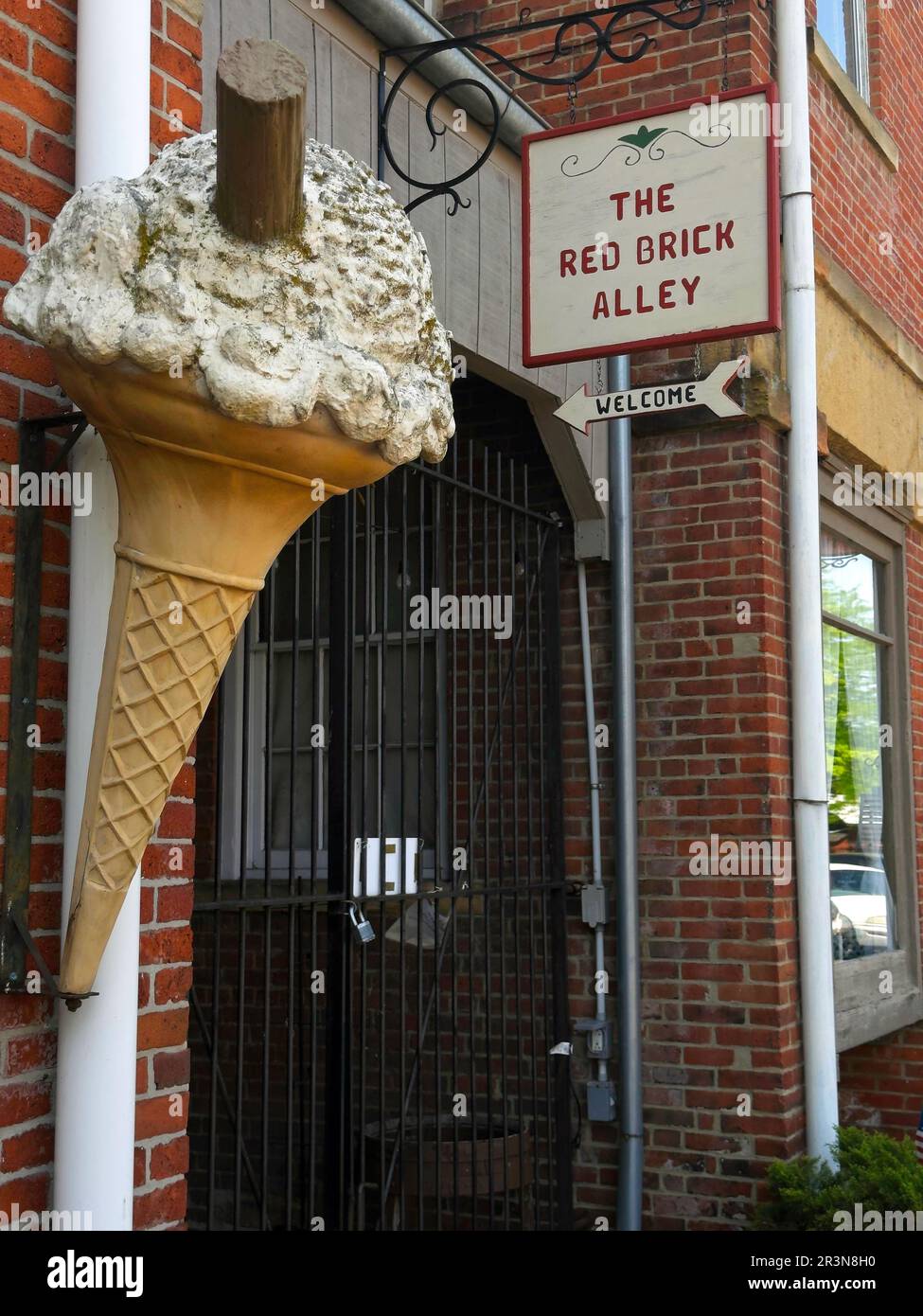 A giant ice cream cone on a building exterior indicates what is offered