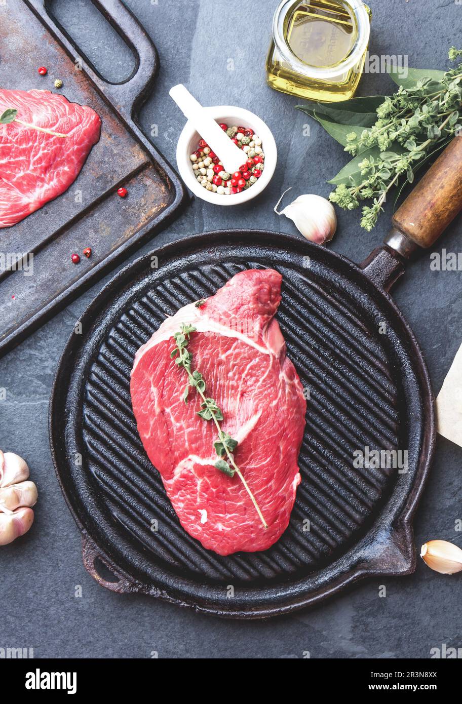 Fresh raw meat. Beef Tenderloin and marbled beef steaks on grill pan ...