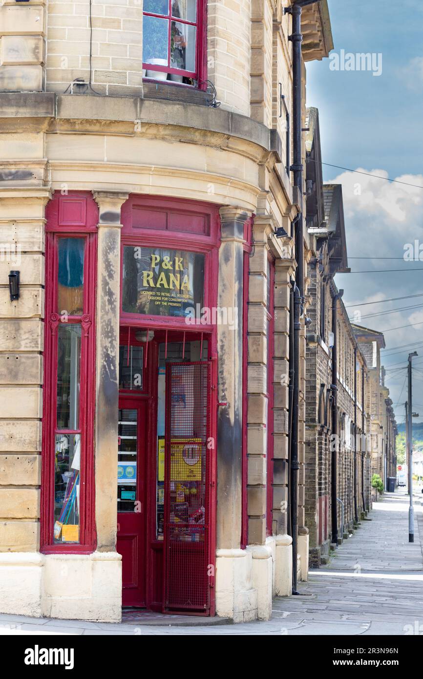 A corner shop and a row of Victorian terraced houses in Caroline Street