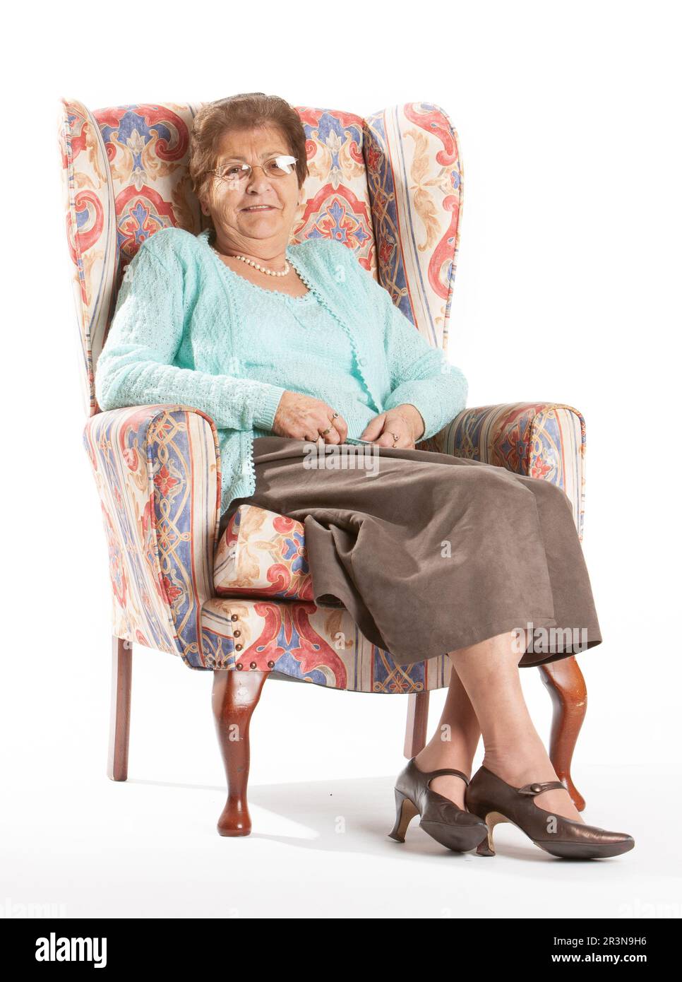 Old lady sitting in a chair hi-res stock photography and images - Alamy