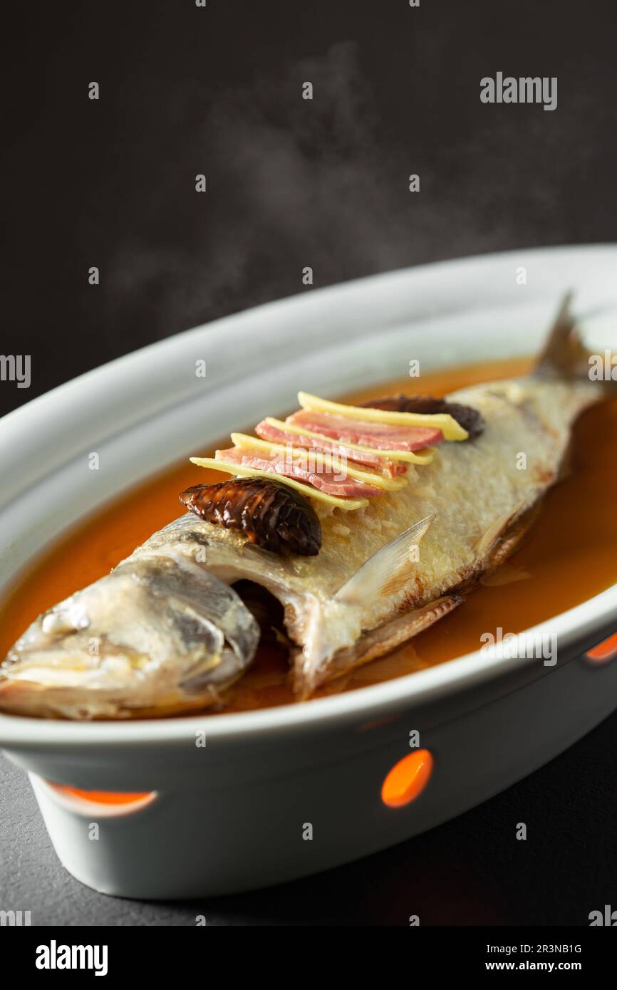 Steamed Topmouth culter fish with ham，Steamed white fish Stock Photo