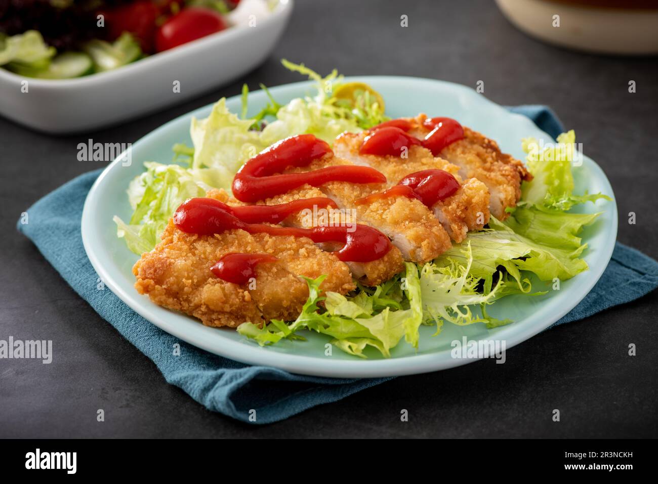 crispy chicken fillet in bread crumbs, closeup Stock Photo Alamy