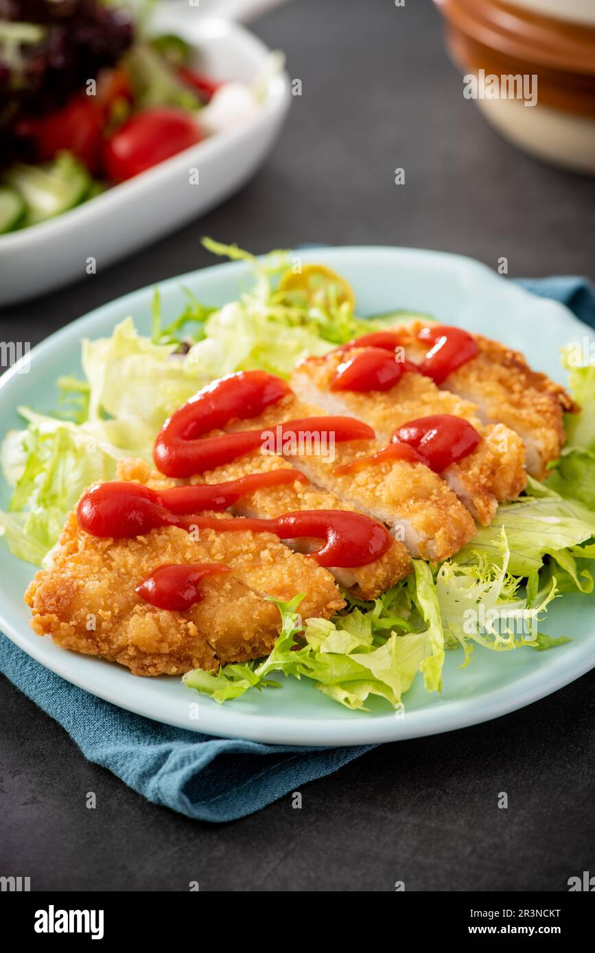 crispy chicken fillet in bread crumbs, closeup Stock Photo Alamy