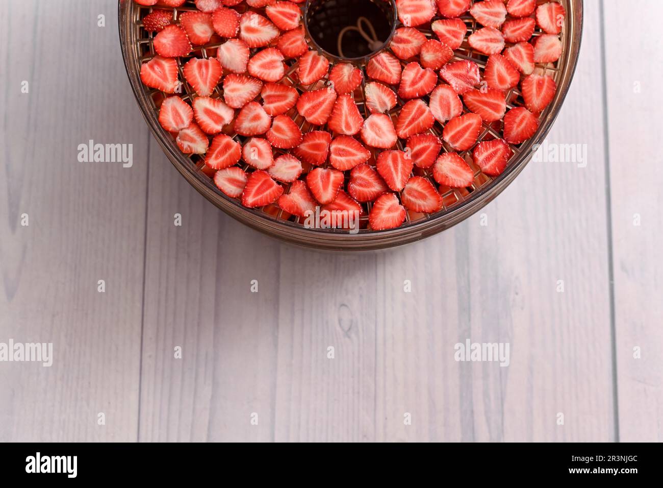 Industrial food dehydrator machine. Professional fruits and vegetables dehydration  machines. Long red pepper in it. Peppers can be dried in the oven a Stock  Photo - Alamy