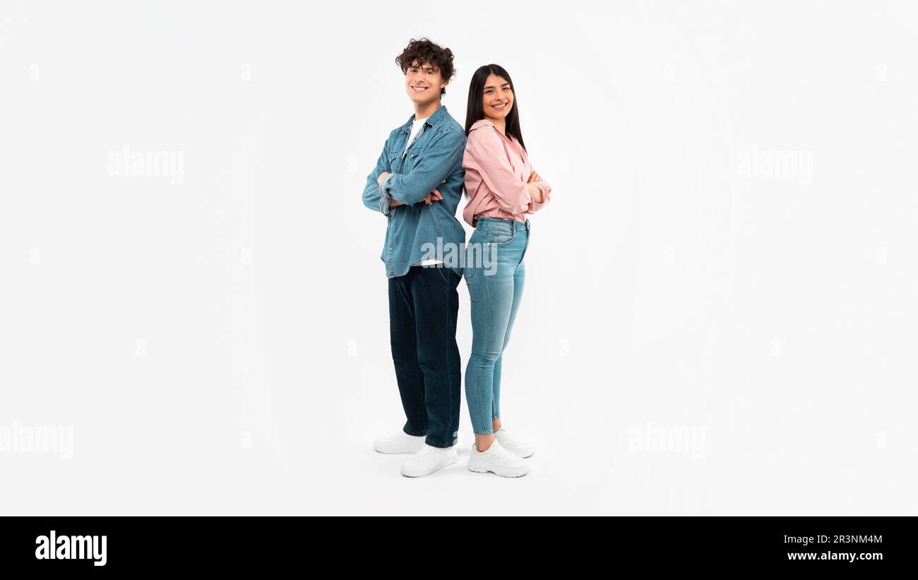 Happy Young Couple Posing Standing Over White Background Stock Photo