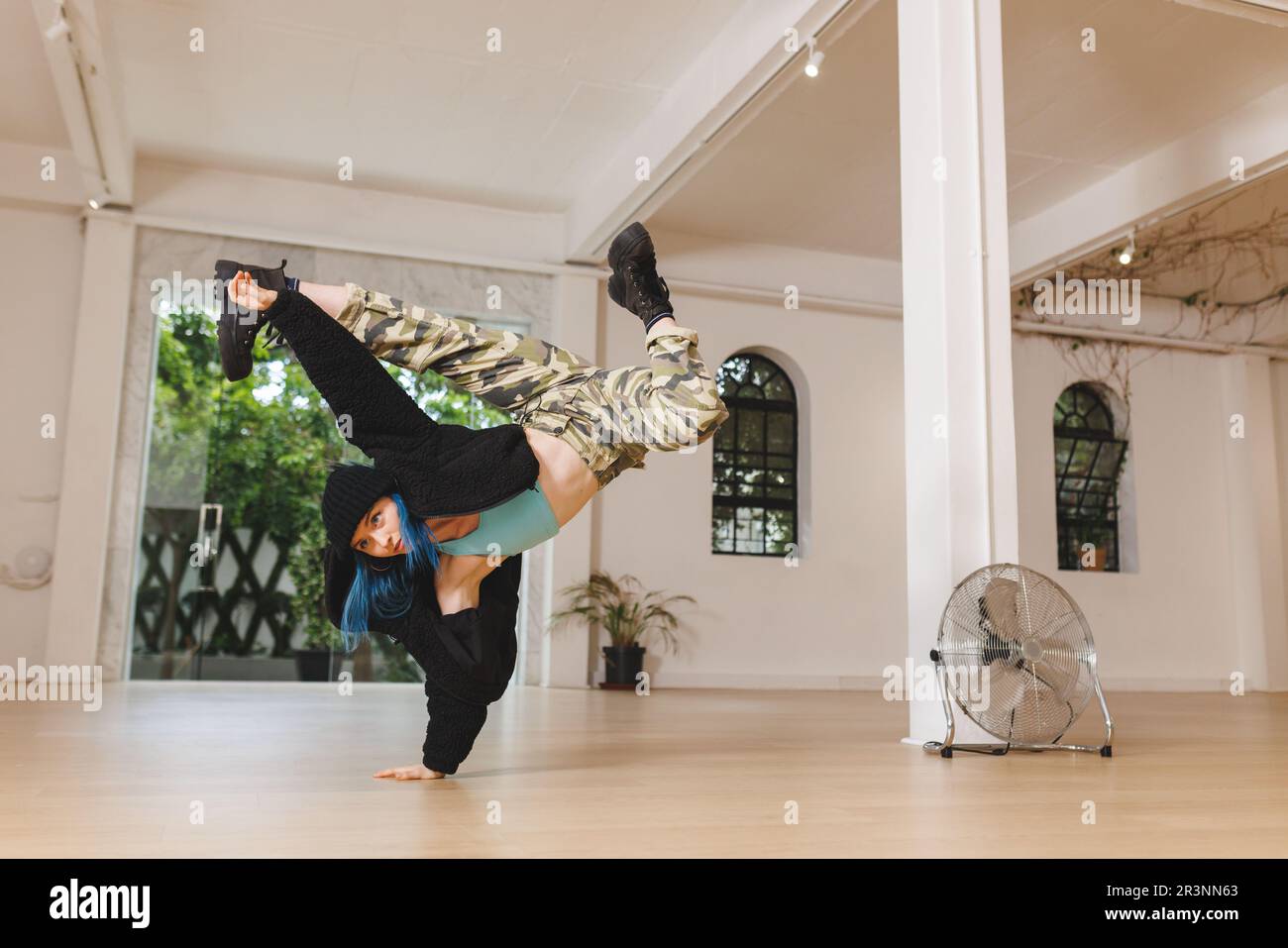 Image of caucasian female hip hop dancer practicing in studio Stock Photo