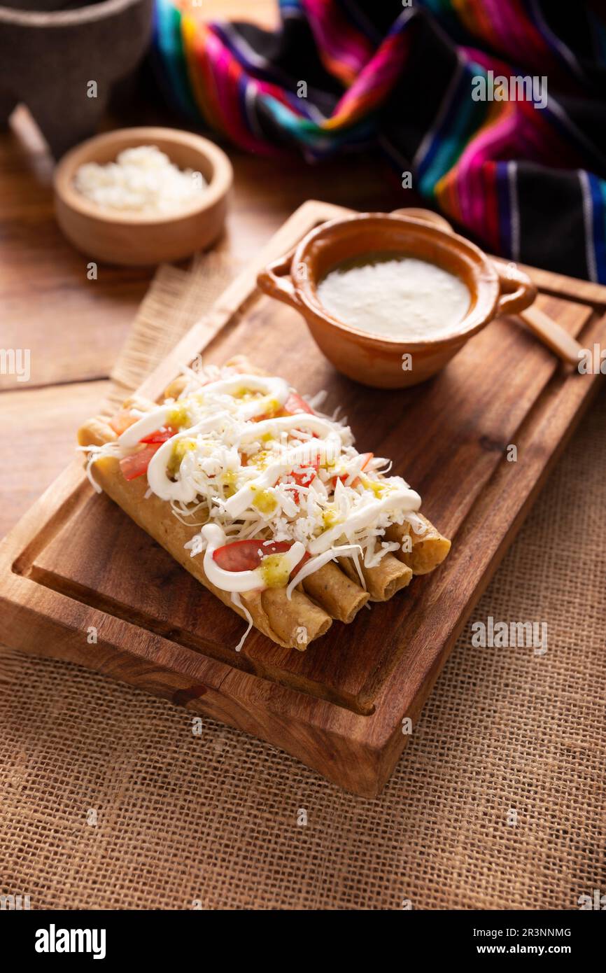 Tacos Dorados. Mexican dish also known as Flautas, consists of a rolled