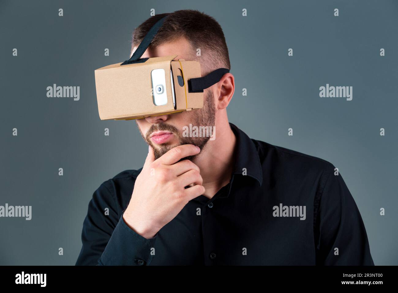 Human Using Virtual Headset Man using a new virtual reality headset on grey background Stock Photo ...