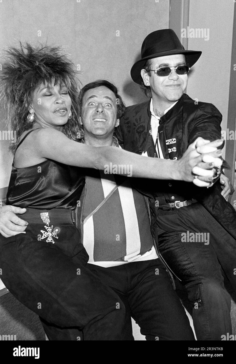 BLACK AND WHITE ONLY File photo dated 18/01/85 of the late chat show host Terry Wogan (centre) with American singer Tina Turner and Elton John at the BBC TV centre in Shepherds Bush, London, to help launch his new three times a week chat show series. Ms Turner, one of rock's most famous voices who had hits including Proud Mary and The Best, has died at the age of 83 after a long illness, her publicist told the PA news agency. Issue date: Thursday May 25, 2023. Stock Photo