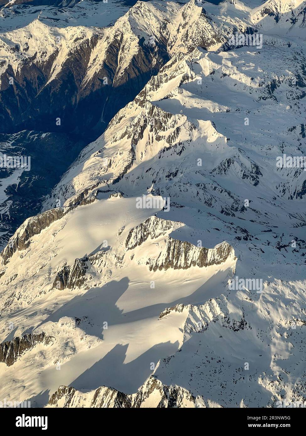 Swiss alps mountain snow aerial valley hi-res stock photography and ...