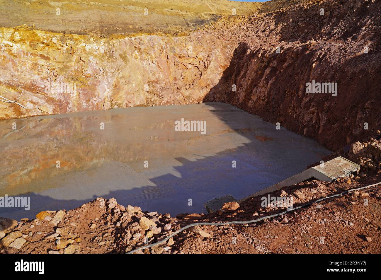 Placement of filling underwater concrete in the construction pits for the abutments Stock Photo