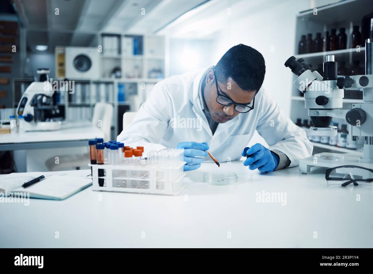 Science, analysis and male scientist in a laboratory doing research ...
