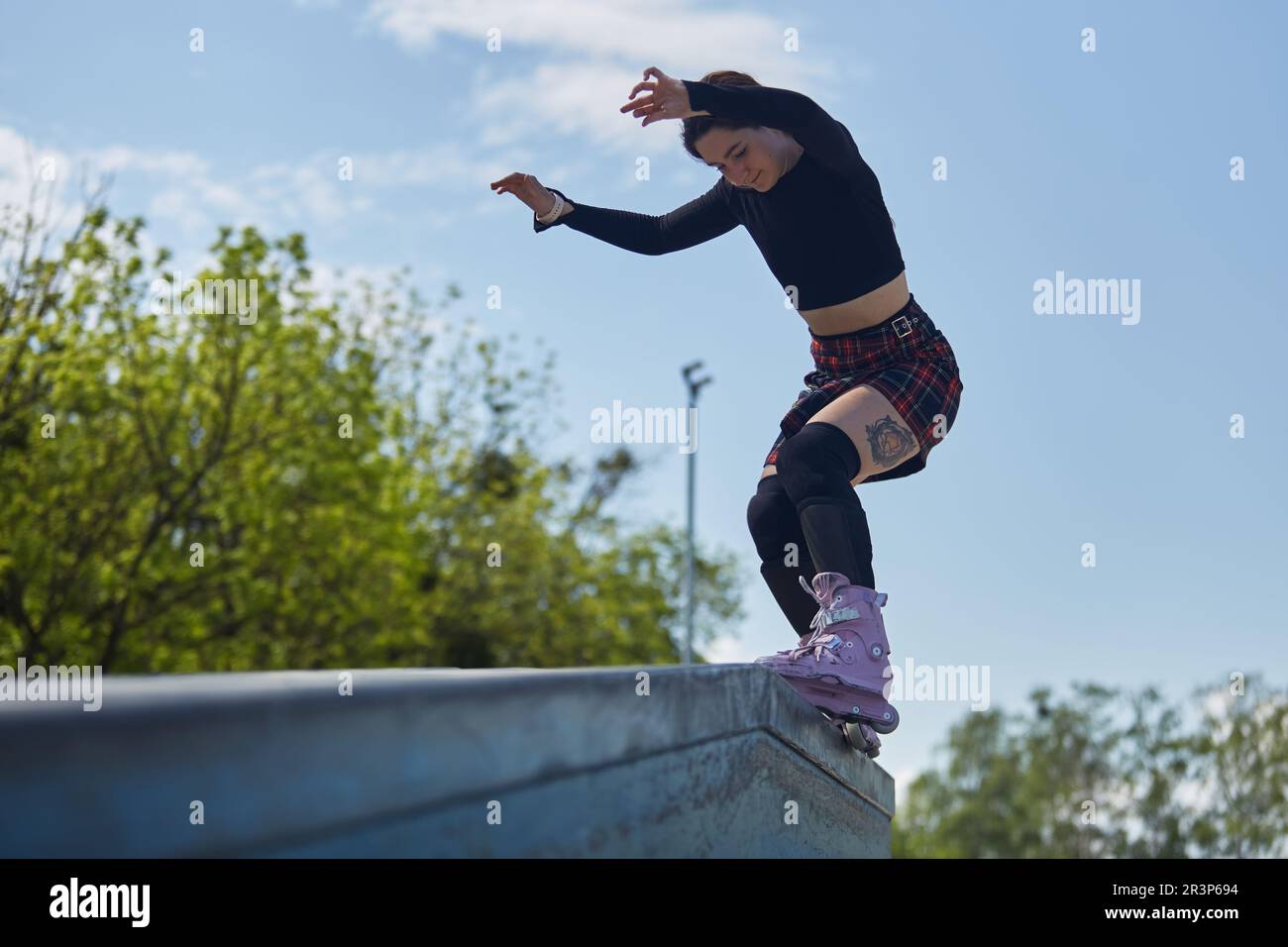 Woman performing aggressive inline skating hi-res stock photography and ...