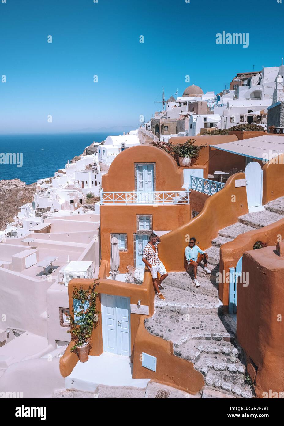 Santorini Greece, couple mid age European and Asian on vacation at the Greek village Oia Santorini Stock Photo