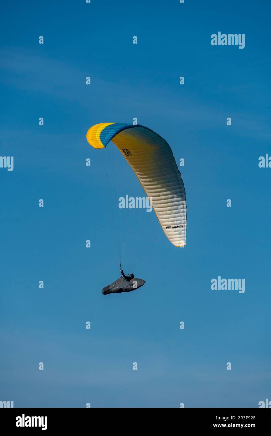 Normandy, France. A paraglider over the fields of Longues-sur-mer, a site of a german coastal gun battery from WWII Stock Photo